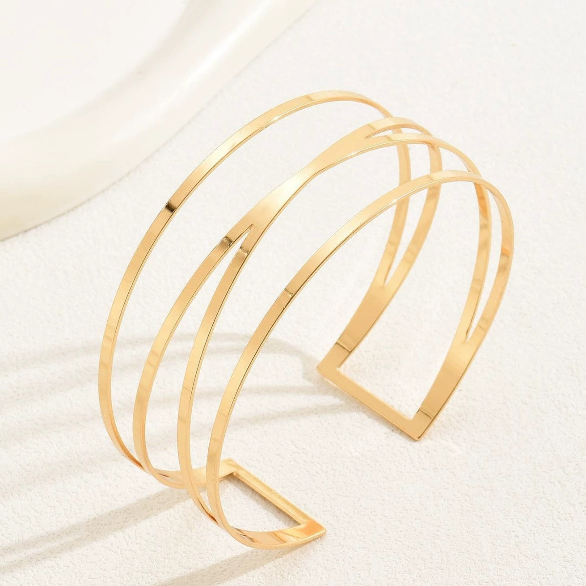 Handcrafted Gold-plated Geometric Cuff Bracelets And Boho-chic Metal Tassel Arm Rings With Vintage-inspired Exaggerated Water Drop Designs, Offering Unisex Luxury Accessories In Open Bangle Styles